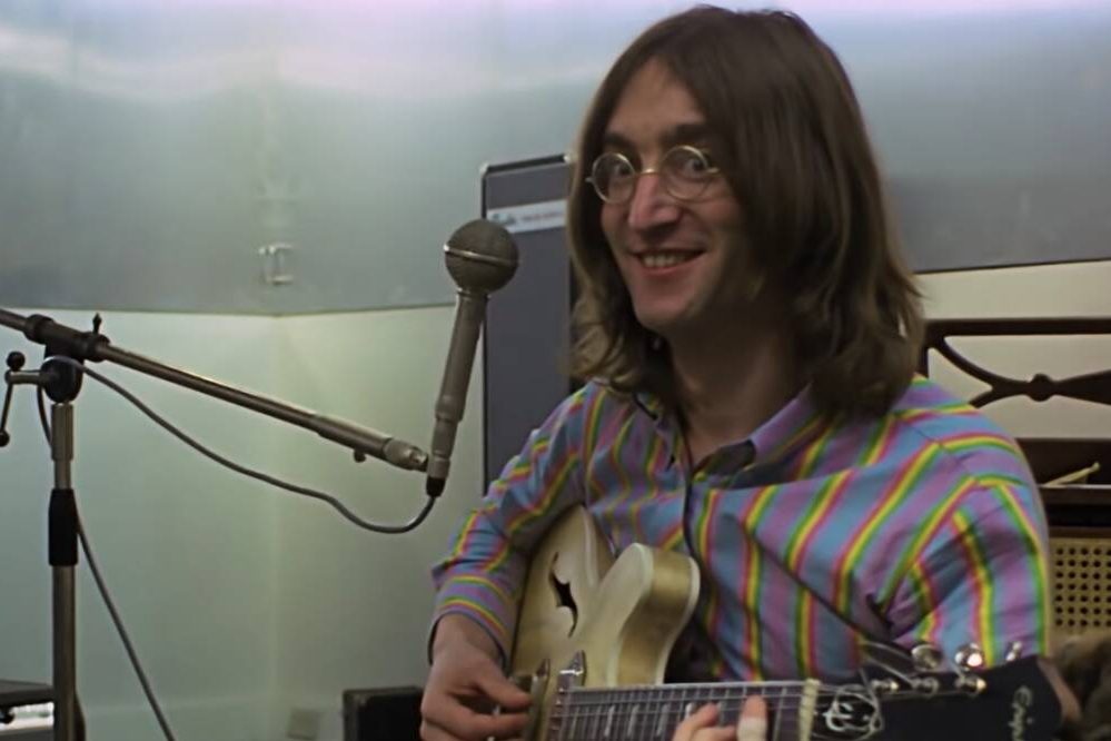 John Lennon in "The Beatles: Get Back". Director Peter Jackson says Disney wanted swearing taken out of the new docuseries.