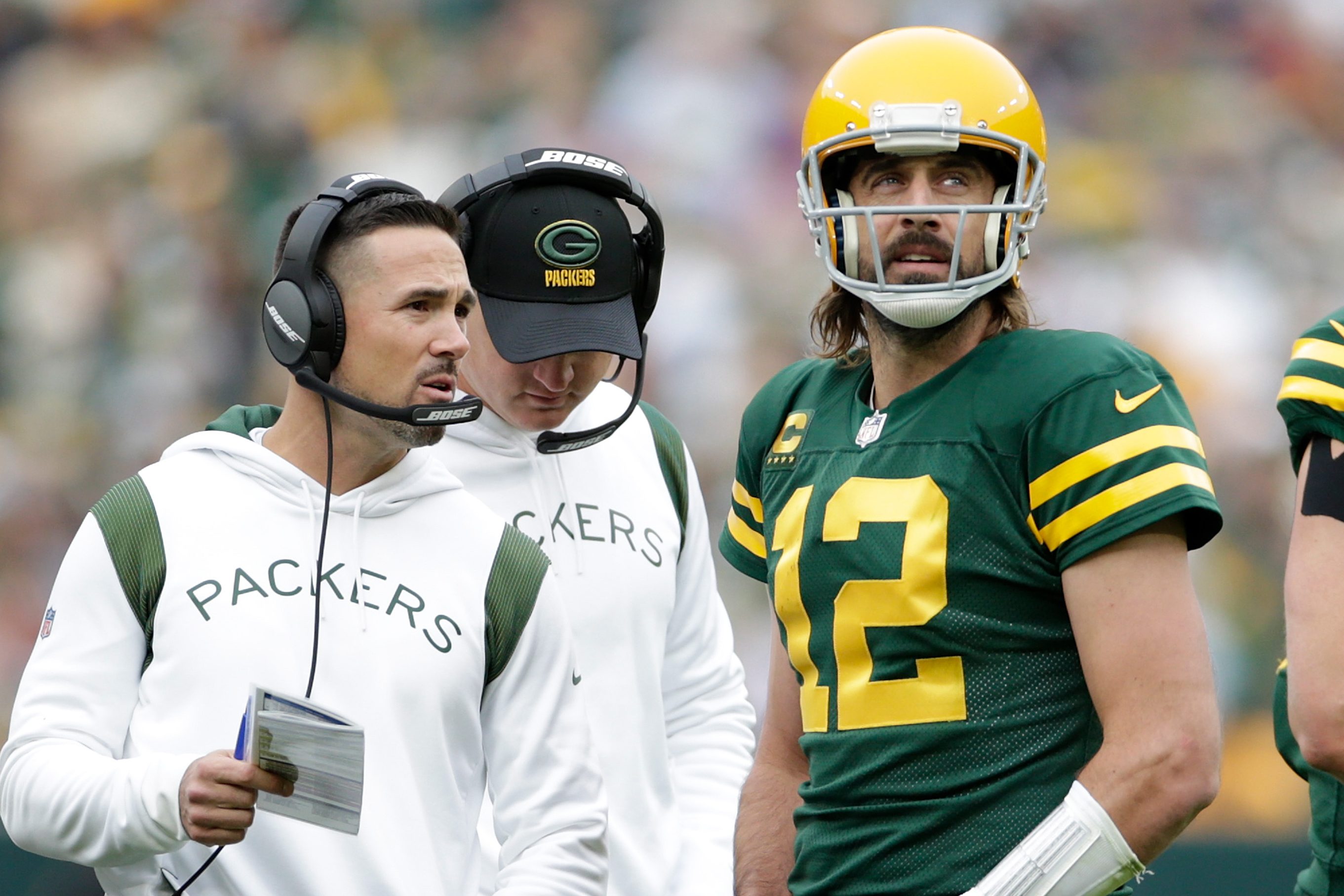 Aaron Rodgers talks with Green Bay Packers head coach Matt LaFleur during a game