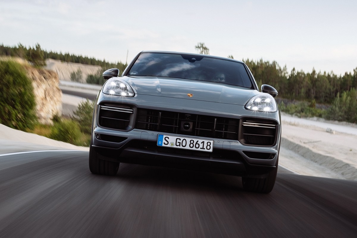 The Porsche Cayenne Turbo GT shot from the front while the luxury SUV is speeding down the road