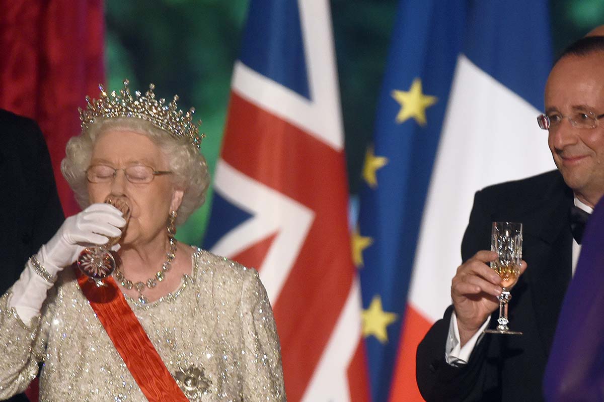 French President Francois Hollande and Queen Elizabeth ll enjoy toasting each other during a State Banquet at the Elysee Palace on June 6, 2014 in Paris, France. The queen designated certain tipples with "Royal Warrants"