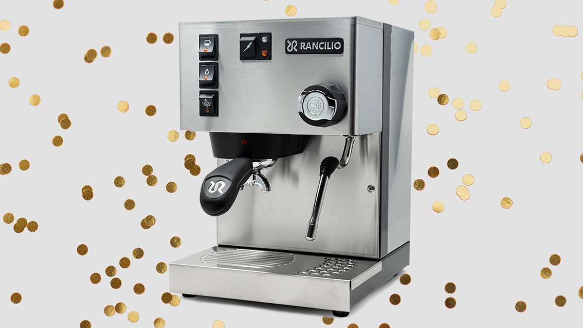 The Italian-made Rancilio Silvia espresso machine, the perfect holiday gift for 2021, on a grey background with gold glitter