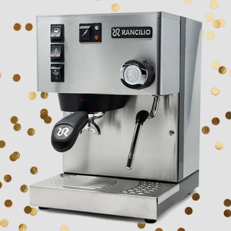The Italian-made Rancilio Silvia espresso machine, the perfect holiday gift for 2021, on a grey background with gold glitter