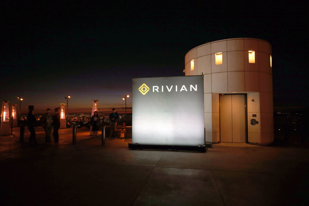 A Rivian sign lit up at night at the Griffith Observatory during the unveiling of the company's first-ever electric adventure vehicle
