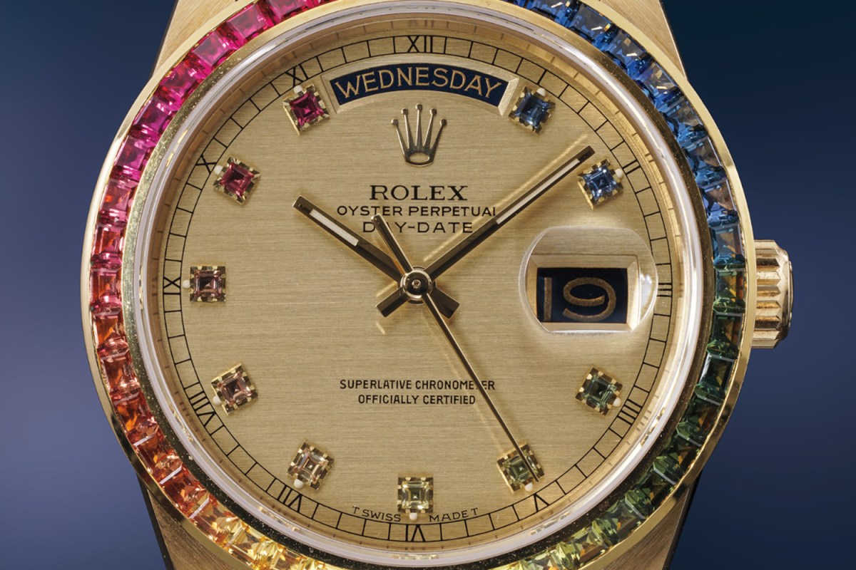 A close-up photo of a Rainbow Rolex Day-Date Ref. 18058 in yellow gold, a rare timepiece that is headed to auction at the upcoming Phillips Geneva sale