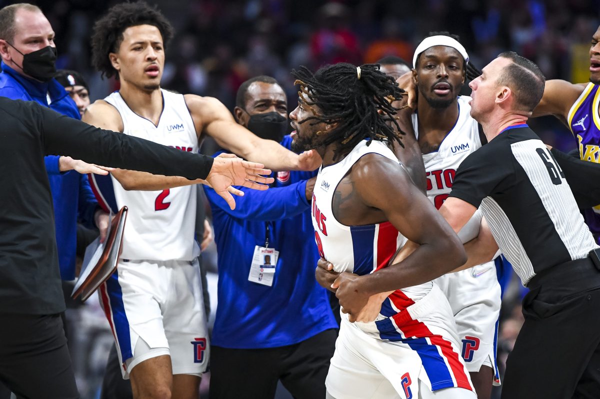Isaiah Stewart of the Detroit Pistons is restrained as he goes after LeBron James