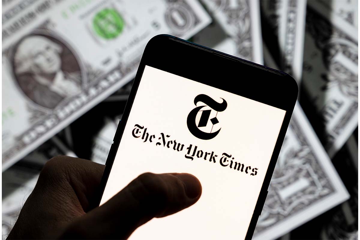In this photo illustration the American newspaper The New York Times (NYT) logo seen displayed on a smartphone with USD (United States dollar) currency in the background. The FTC just made it harder for places offering subscriptions, like the New York Times, to prevent subscribers from cancelling easily.