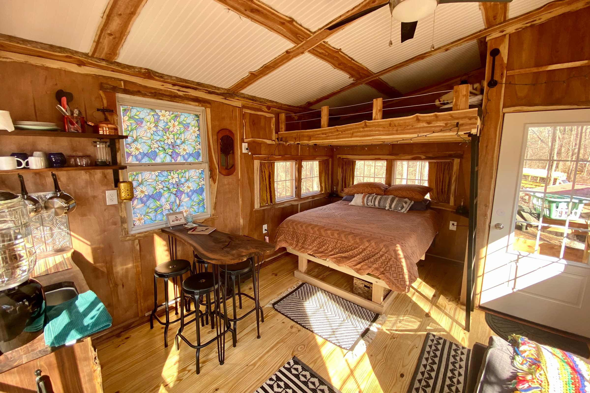 The bedroom in Sutherland's treehouse vacation rental.