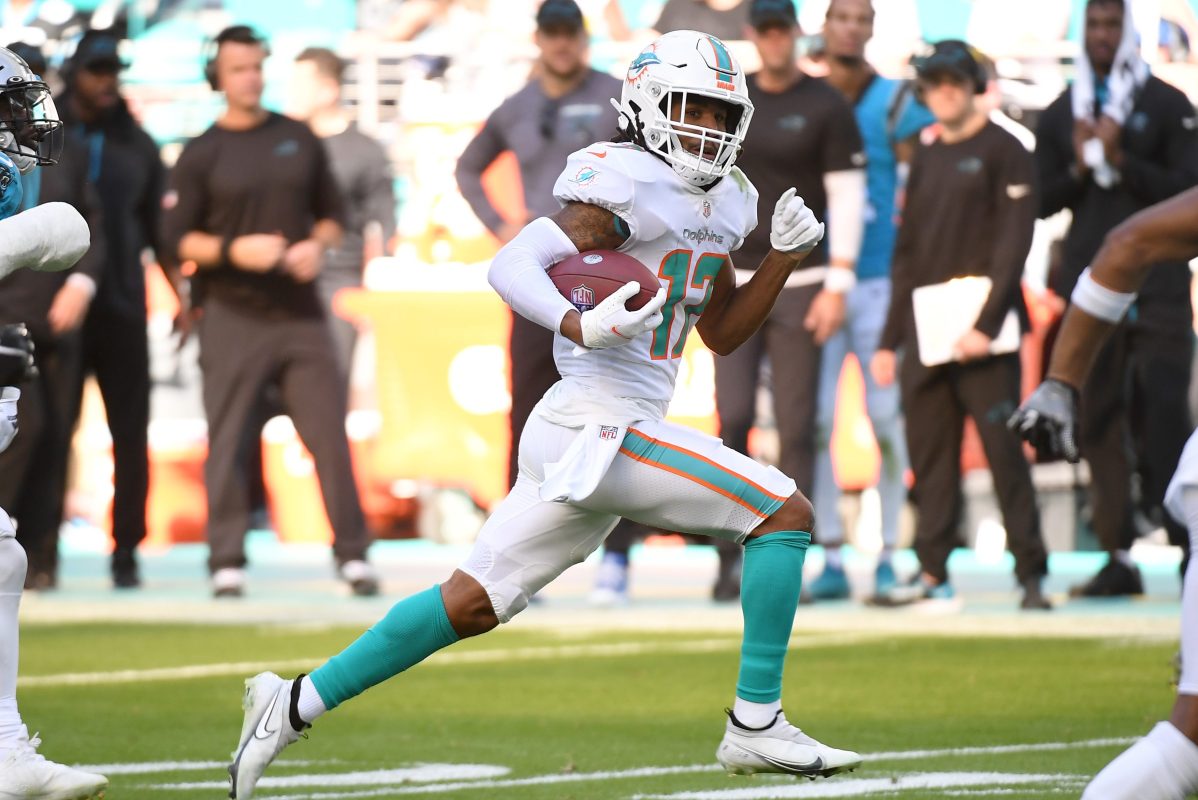 Jaylen Waddle of the Miami Dolphins runs after a catch