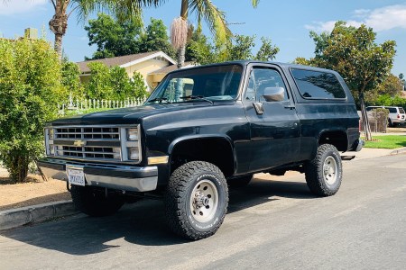 A 1988 Chevy K5 Blazer Silverado sitting on the curb in Los Angeles, California. Want to buy one of these classic SUVs? We asked Kyle Cheromcha what it's like owning one.