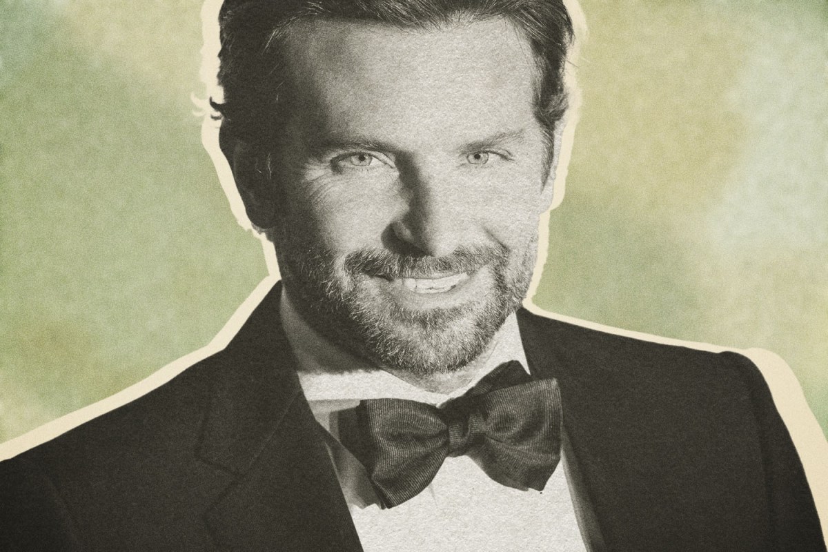Bradley Cooper smiles in a black bow tie and tuxedo on the red carpet