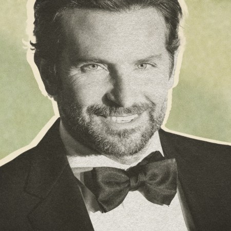 Bradley Cooper smiles in a black bow tie and tuxedo on the red carpet