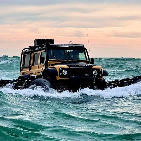 A Land Rover Defender 110 from the DefenderX expedition driving through the English Channel in October 2021. We interviewed team lead Jeff Willner about the overland expedition.