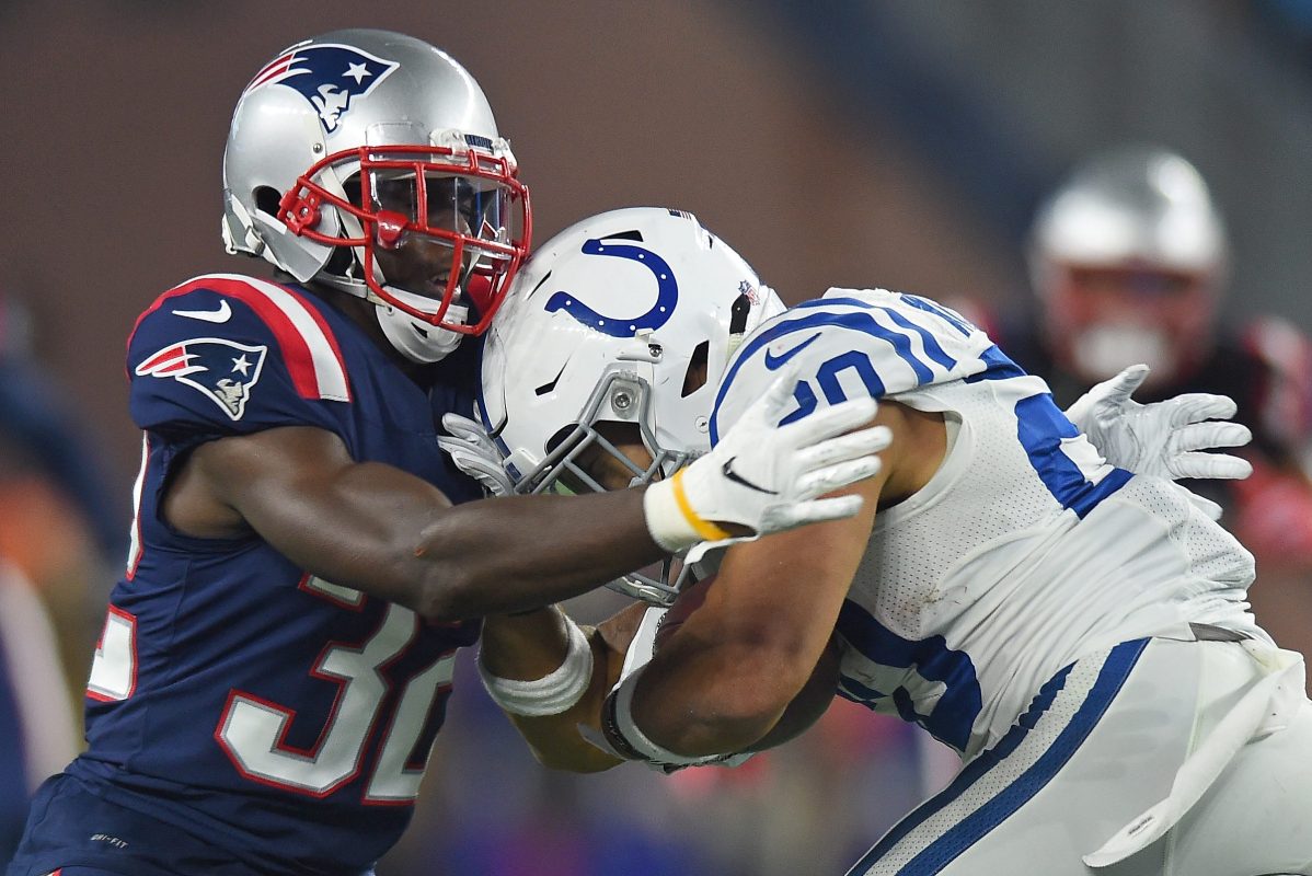 Devin McCourty of the New England Patriots stops Jordan Wilkins of the Indianapolis Colts
