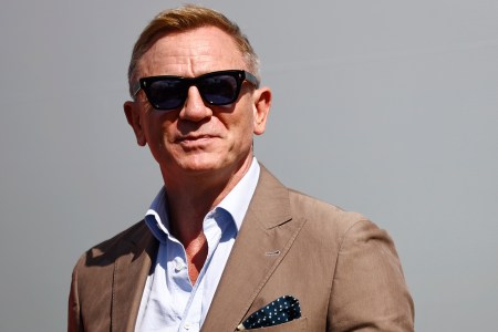 Daniel Craig attends pre-race ceremonies prior to the NASCAR Cup Series Bank of America ROVAL 400 at Charlotte Motor Speedway on October 10, 2021 in Concord, North Carolina. A James Bond producer says the next Bond will be a British man.