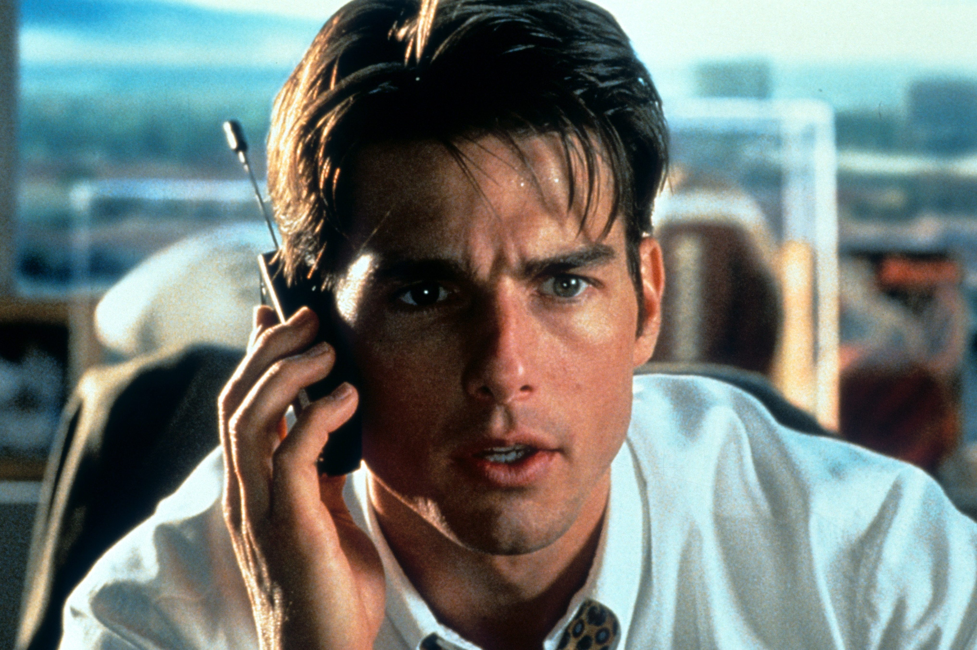 Tom Cruise talks on a phone in a scene from the film "Jerry Maguire."
