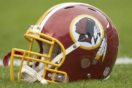 A closeup of Washington's former NFL helmet on the field before a 2014 game