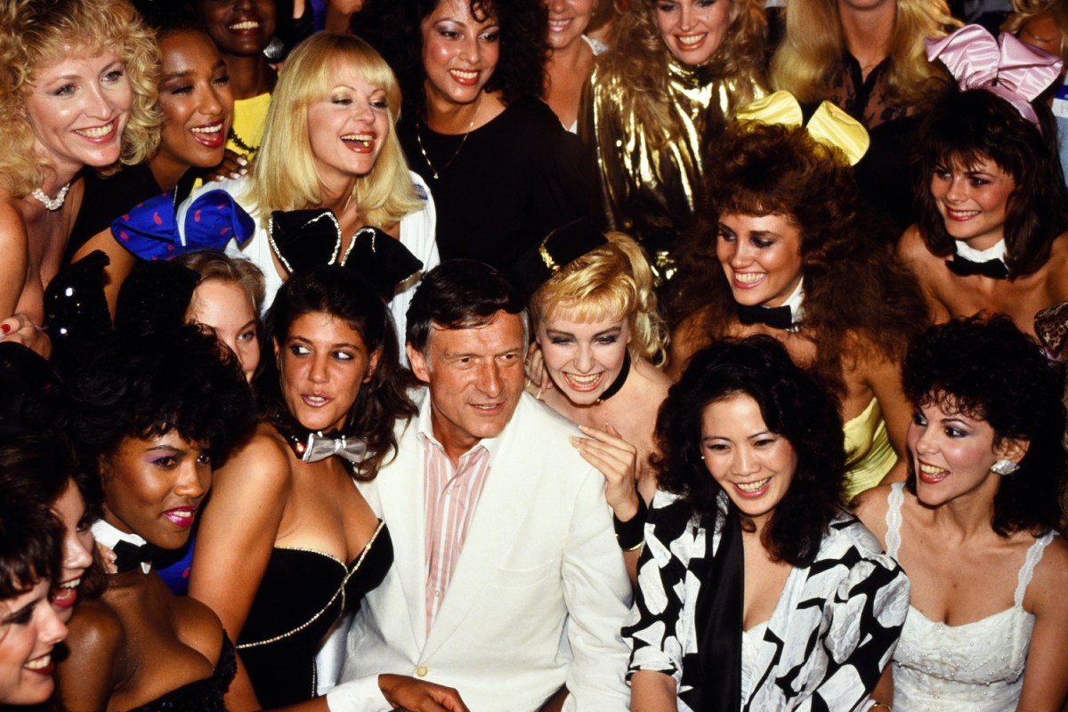 Hugh Hefner surrounded by women in 1986. a new docuseries claims Quaaludes were commonly used at Playboy Mansion.