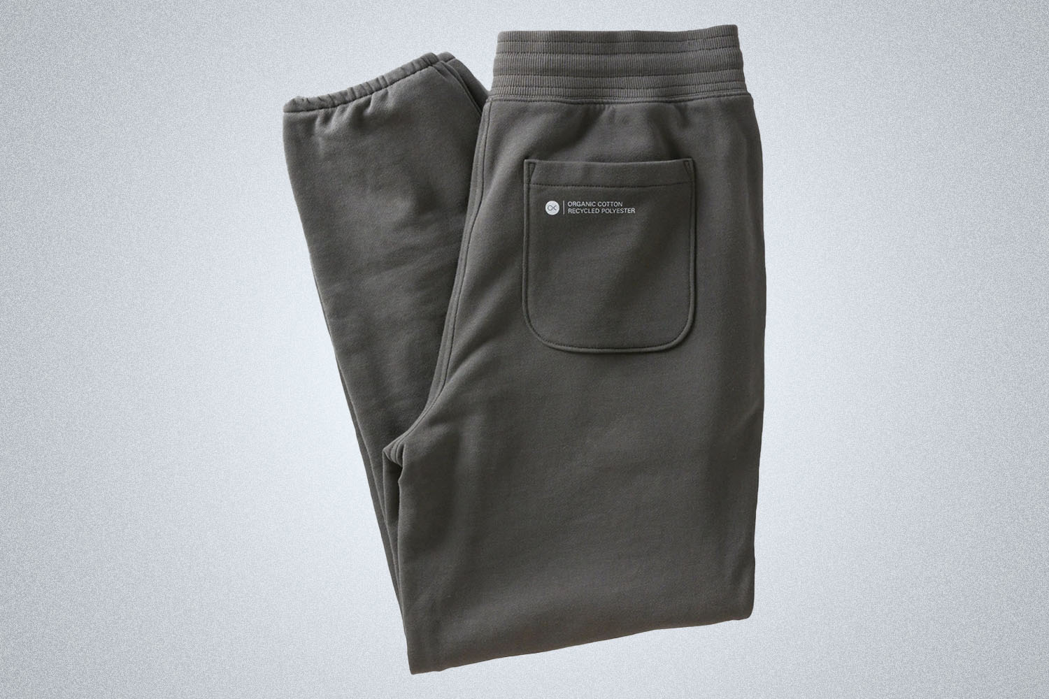 A pair of Grey sweatpants from Outerknown on a light grey background