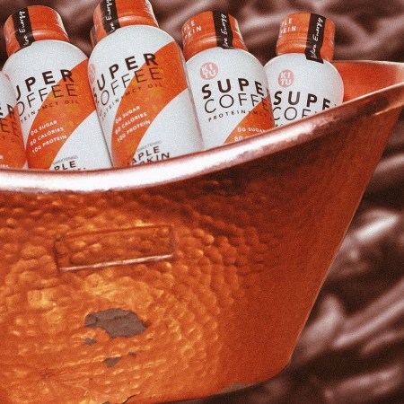A tub of Super Coffee against a coffee-inspired background.