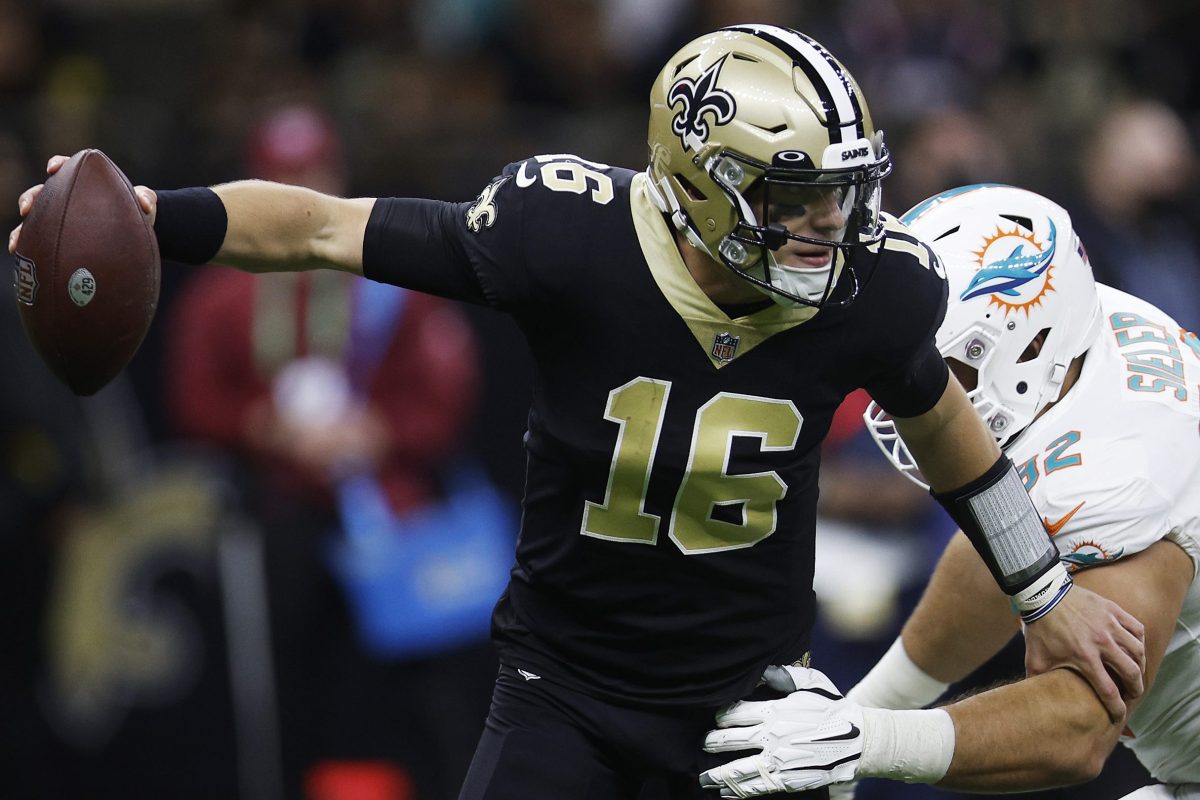 Zach Sieler of the Miami Dolphins pressures Ian Book of the New Orleans Saints. Book made his NFL debut on Monday Night Football, and it was not pretty.