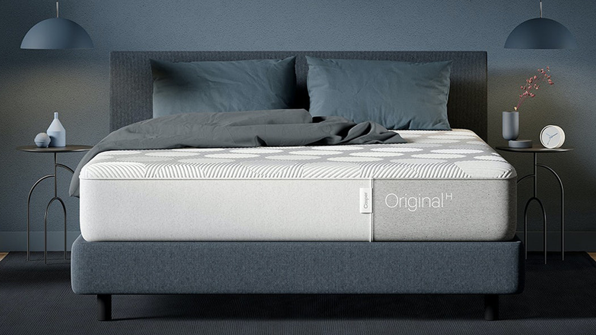 The Casper Original Hybrid Mattress in a blue tone bedroom. The mattress is on sale for Cyber Week 2021.