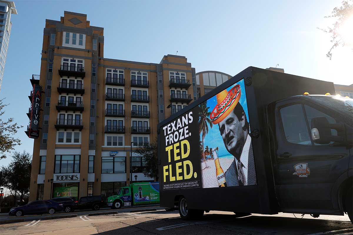 A digital billboard truck with an image of U.S. Sen. Ted Cruz (R-TX) sits in a parking lot near Senator Cruz's home on February 19, 2021 in Houston, Texas. Ted Cruz is facing criticism after he left Texas to go to Cancun, Mexico with his family during an unprecedented winter storm that brought freezing temperatures and widespread power outages throughout the state.
