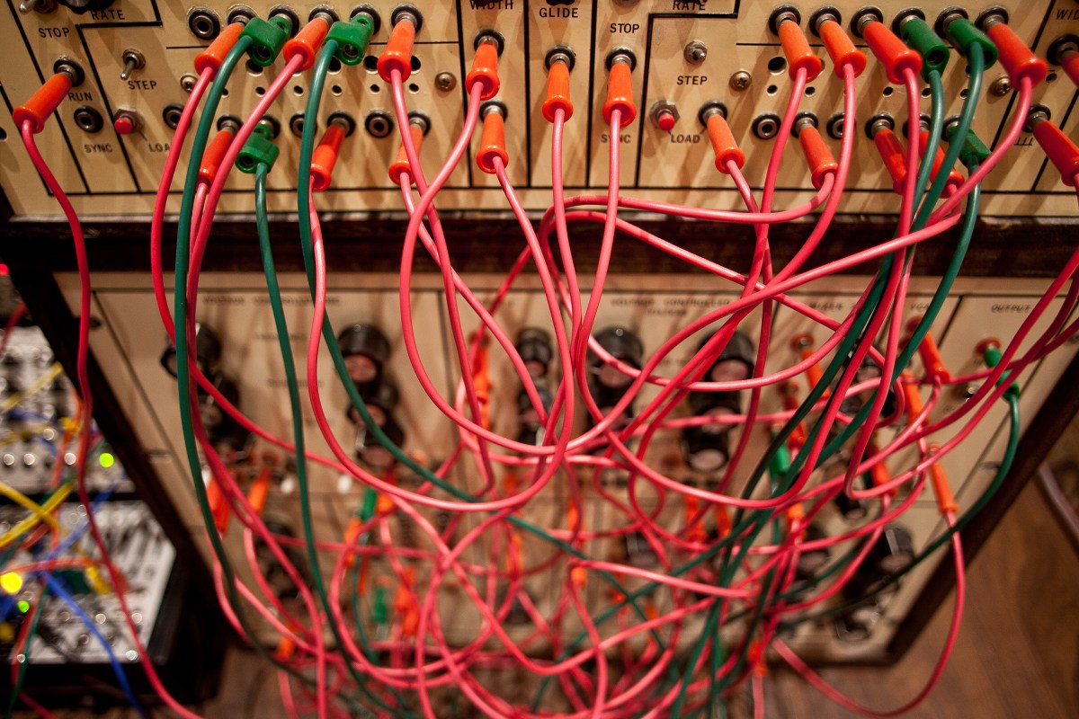 Synth racks and patch leads in the home studio of American electronica musician and sound designer Richard Devine