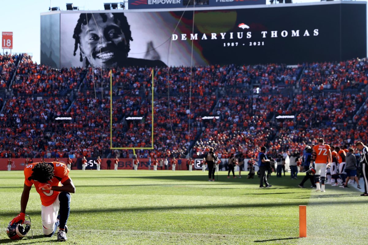 Teddy Bridgewater of the Denver Broncos kneels during the tribute to Demaryius Thomas