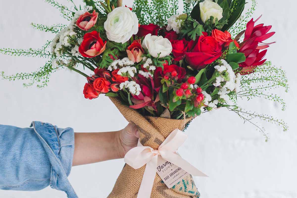A bouquet held up a person off-camera