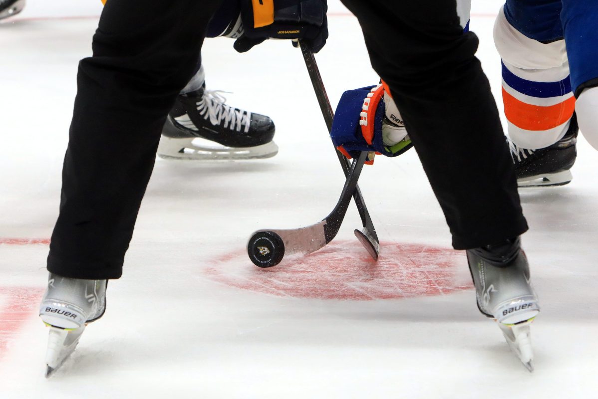 A general view of a puck during a face-off during an NHL game