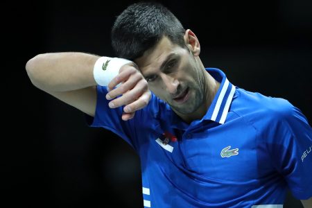 Novak Djokovic of Serbia wipes away sweat during a Davis Cup semifinal match
