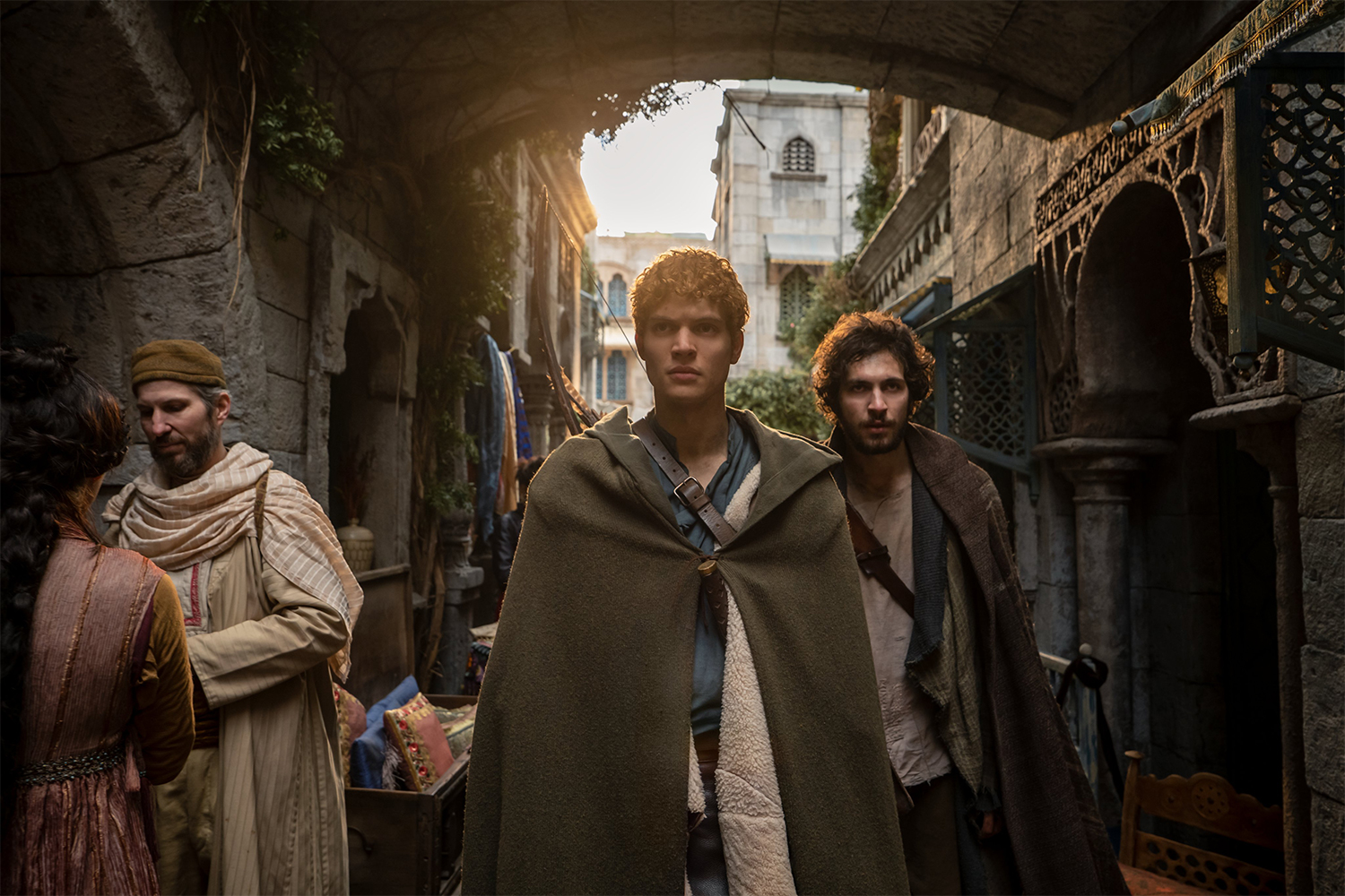 Josha Stradowski (center, as Rand al'Thor) and Barney Harris (right, as Mat Cauthon) in the first season of the Amazon Prime Video series "The Wheel of Time"