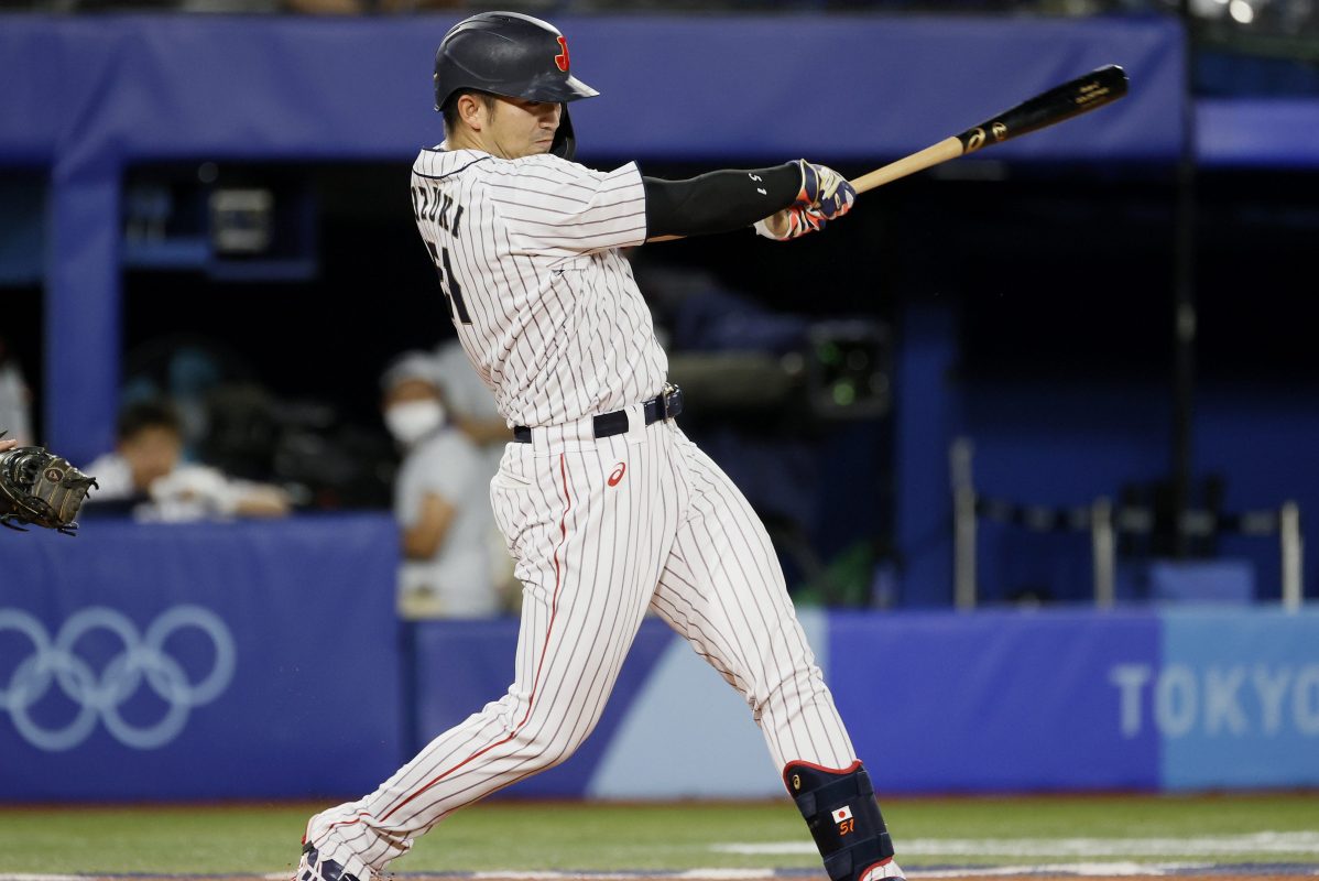 Outfielder Seiya Suzuki of Team Japan hits a single against Team USA at the 2020 Olympic Games in Tokyo.