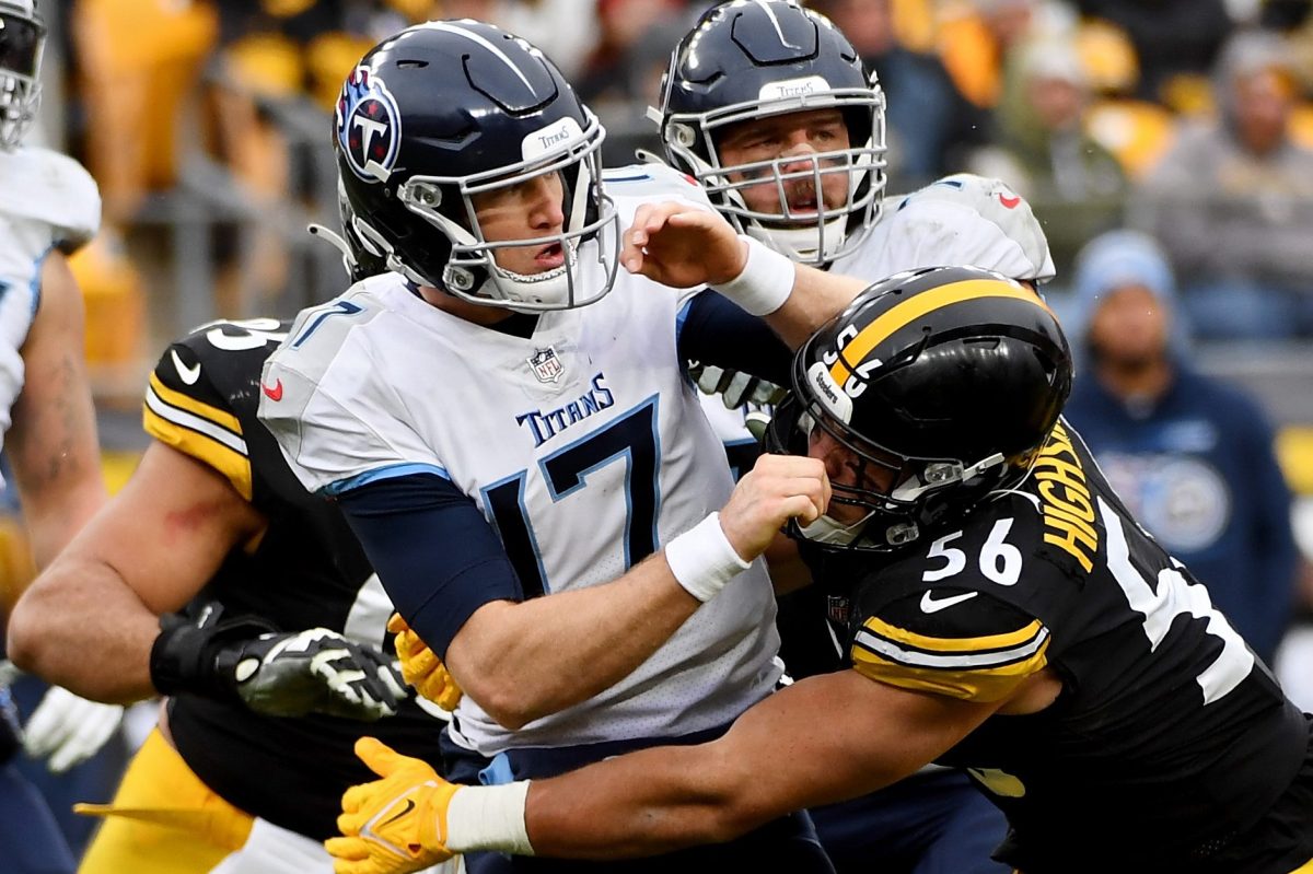 Ryan Tannehill of the Titans is tackled by Alex Highsmith of the Steelers