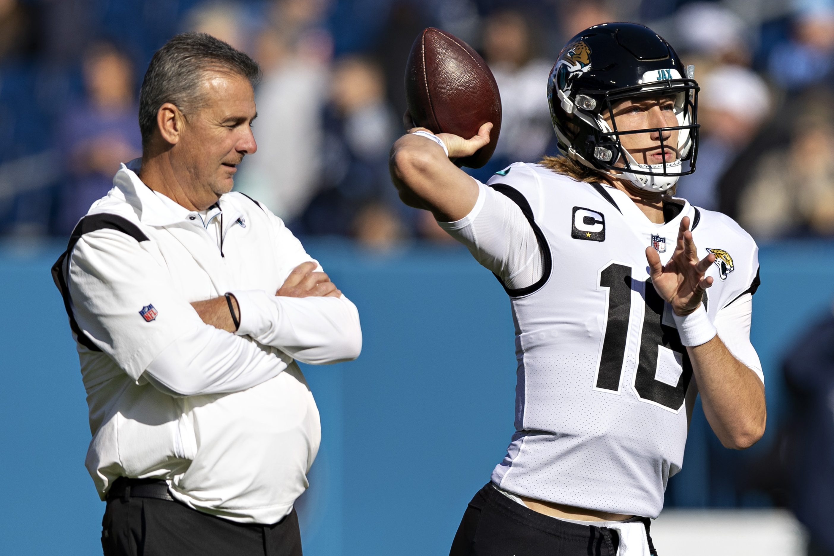 Jacksonville Jaguars QB Trevor Lawrence warms up in front of former coach Urban Meyer