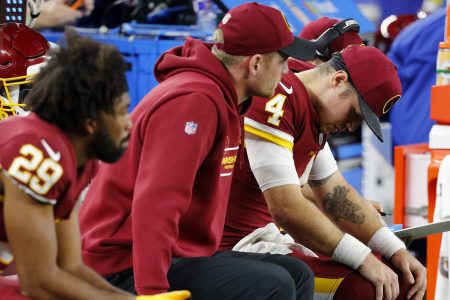 Taylor Heinicke of the Washington Football Team reacts on the sidelines