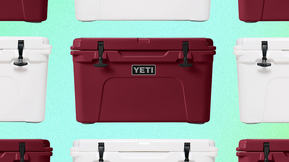 A grid of red and white Tundra hard coolers from Yeti on a green background. Yeti is offering free expedited shipping for guaranteed Christmas Eve delivery.