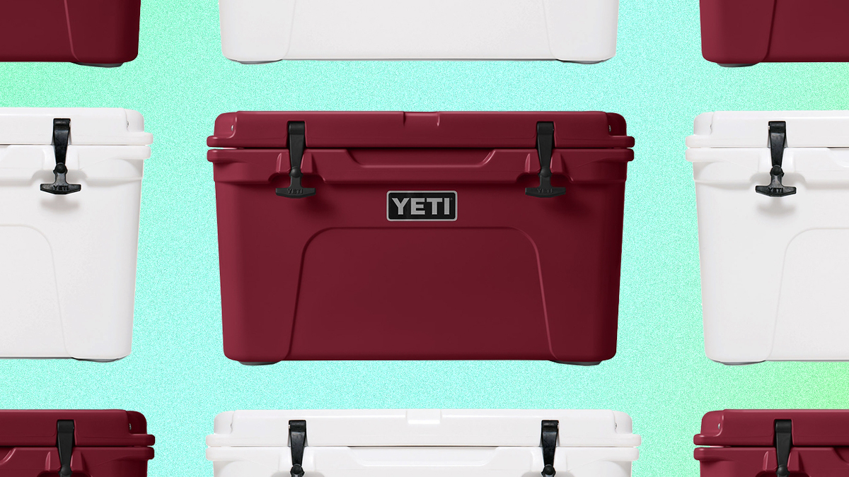 A grid of red and white Tundra hard coolers from Yeti on a green background. Yeti is offering free expedited shipping for guaranteed Christmas Eve delivery.