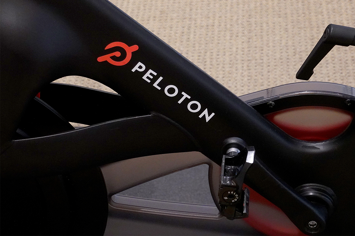 A close-up photo of the Peloton Bike. Peloton is ramping down production on several products due to a decrease in demand.