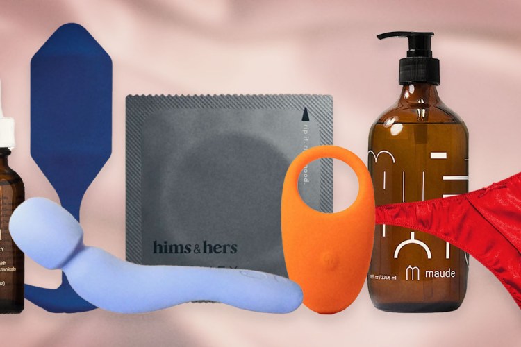 A blue butt plug, orange penis ring, grey condom wrapper, light purple vibrator wand, a pump bottle of lube, perfect Valentine's Day gifts, on a pink background