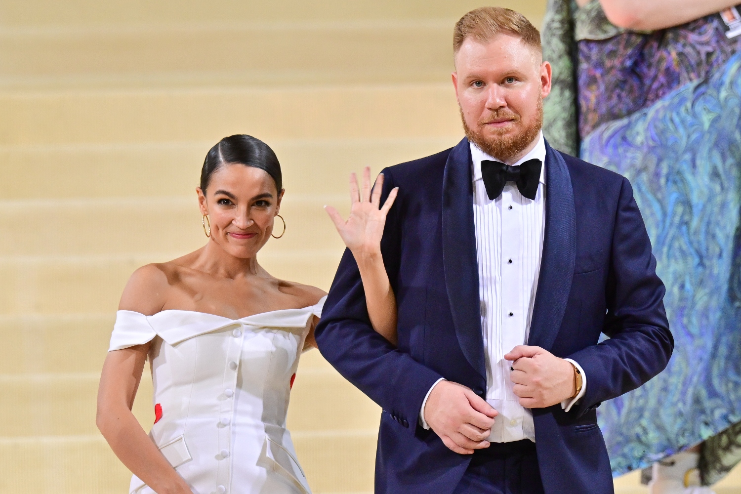 Alexandria Ocasio-Cortez and Riley Roberts leave the 2021 Met Gala Celebrating In America: A Lexicon Of Fashion at Metropolitan Museum of Art on September 13, 2021 in New York City. A columnist recently tried to attack the boyfriend for having gross feet.