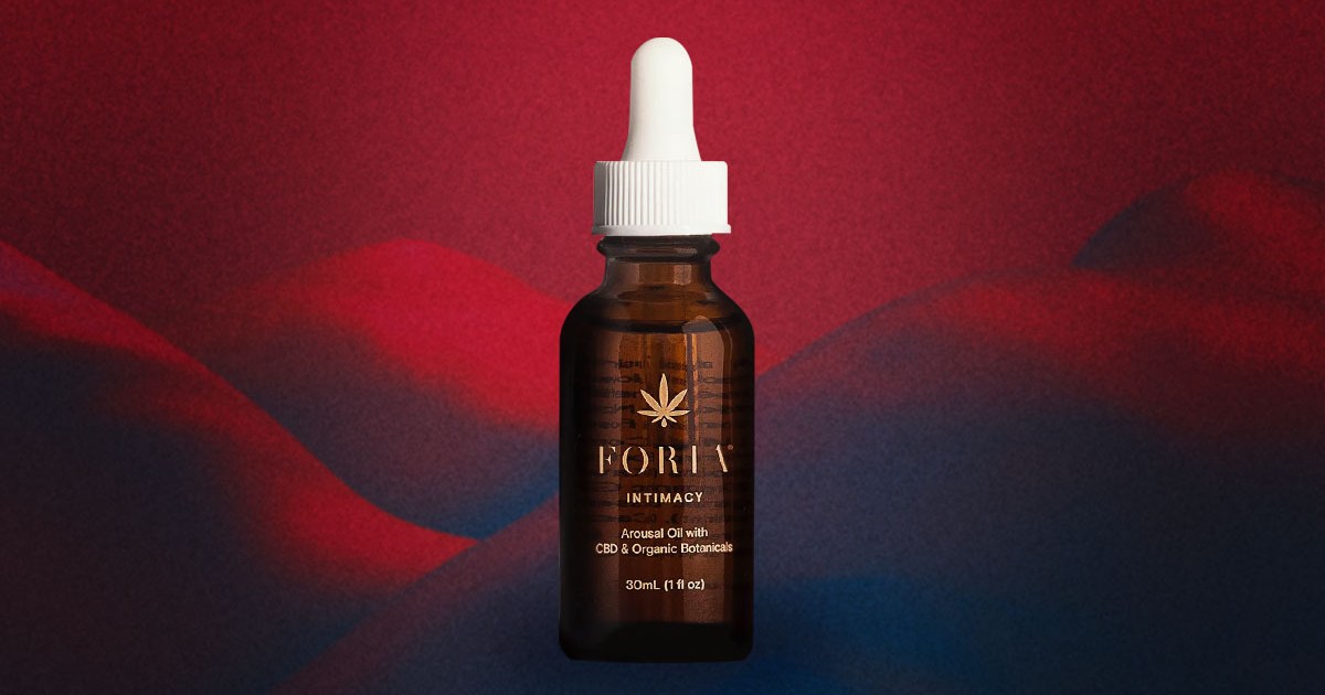 Foria's Awaken Arousal Oil on a red and black background.