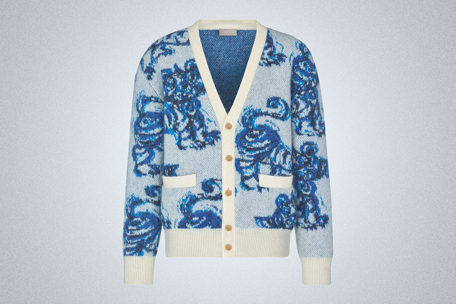 a blue and white printed cardigan with tiger graphics
