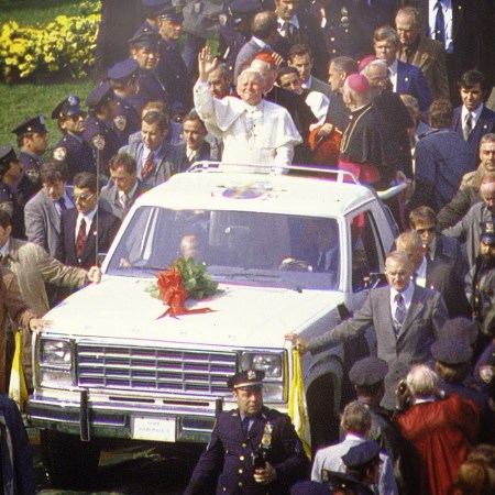 Pope John Paul II arriving at Shea Stadium in New York, New York on October 3, 1979 standing in the truck bed of a 1980 Ford Bronco the automaker converted into a white popemobile