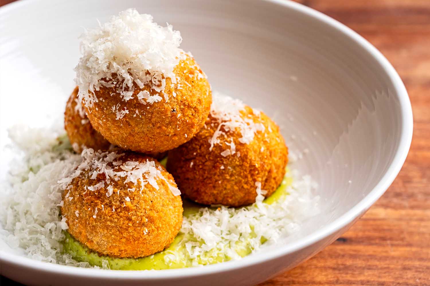 A bowl of Cacio e Pepe Arancini from DC restaurant The Red Hen. 