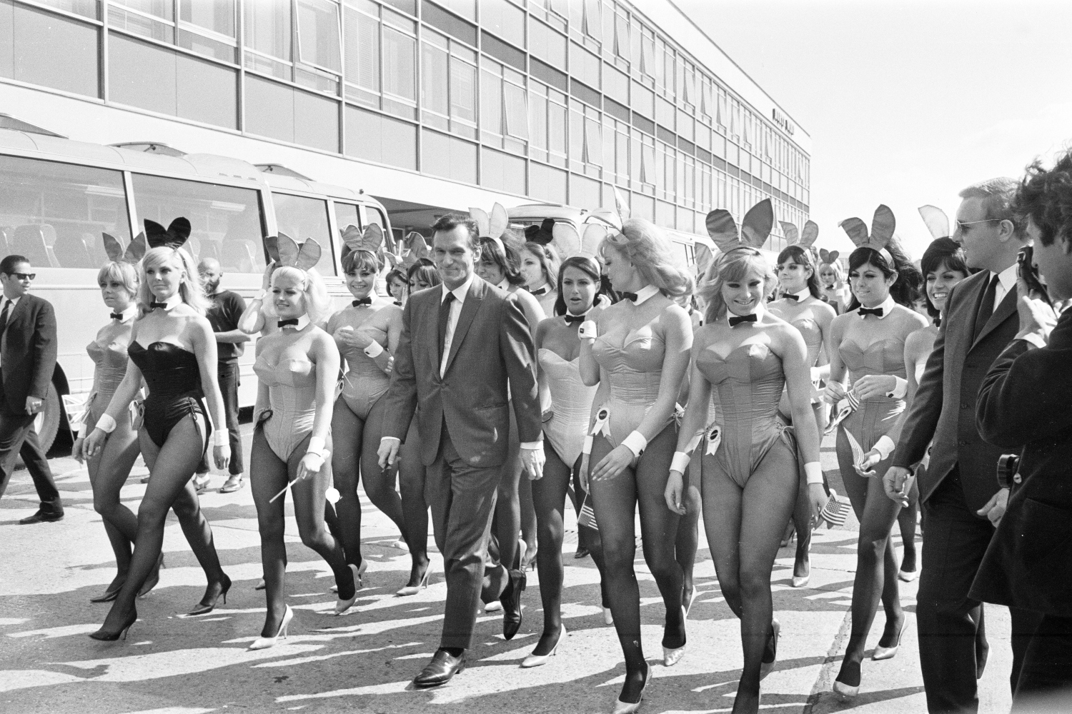 Hugh Hefner Boss of the Playboy Empire arrives with an entourage of Bunny Girls at London Heathrow Airport, Saturday 25th June 1966. Heff, is in Britain to officially open his 16th Playboy Club, located in Park Lane, London.