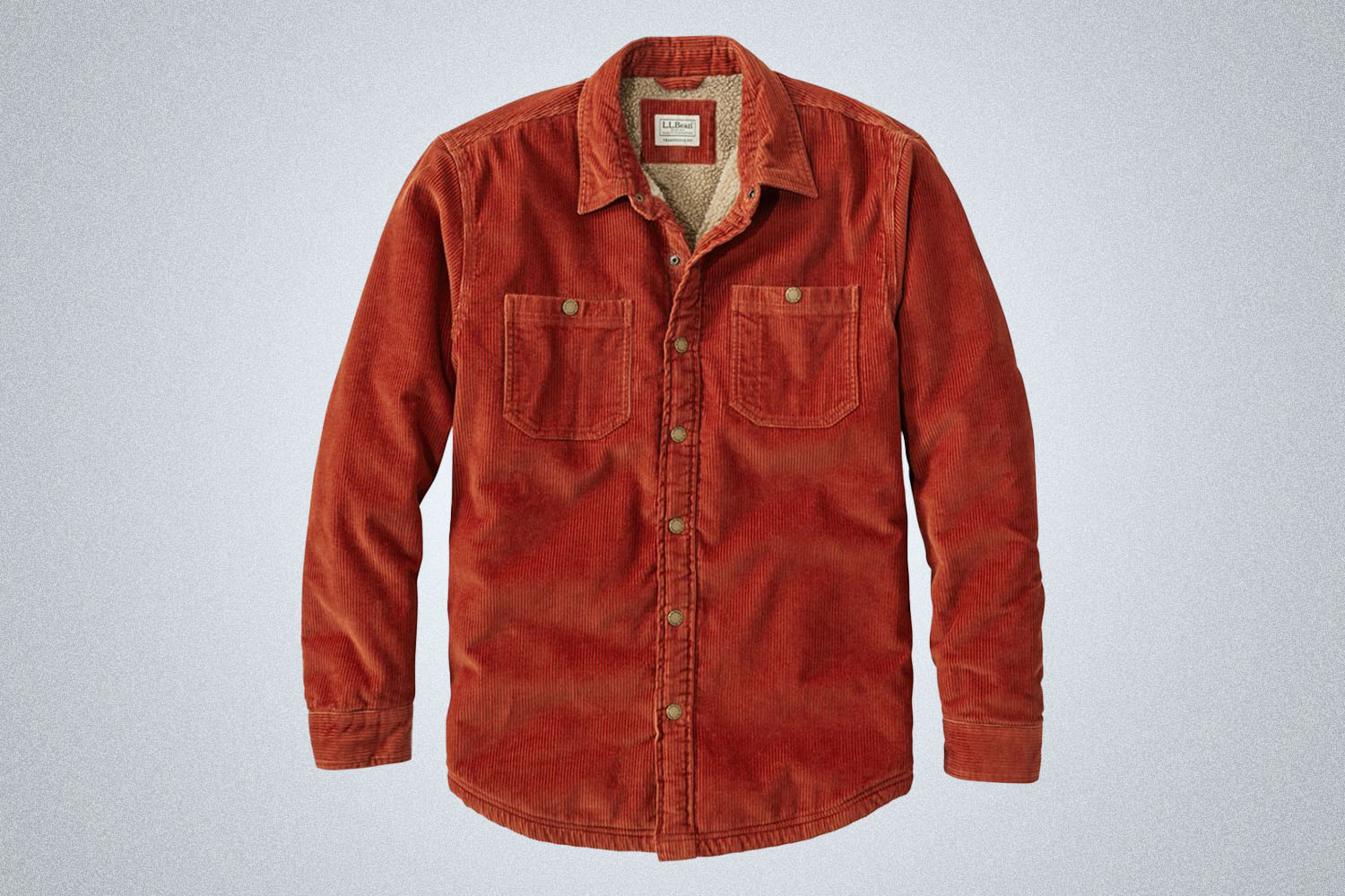 A red corduroy shirt jacket on a grey background