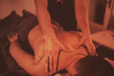 A man getting a massage, possibly a lymphatic draining massage.