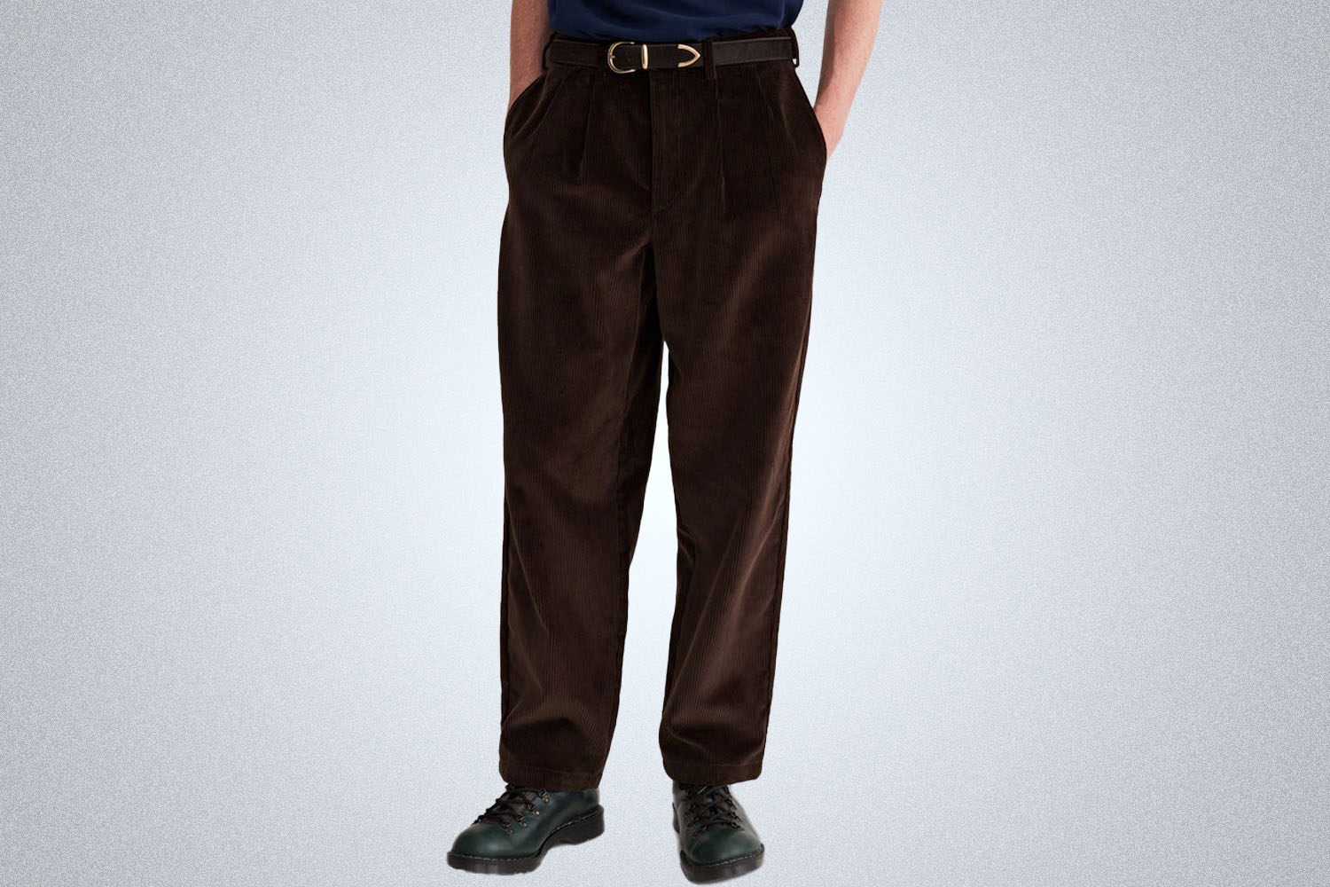 a pair of brown corduroy pants on a model