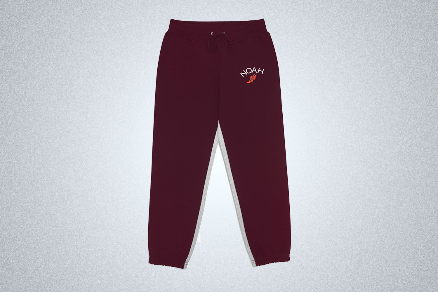 a pair of Burgundy, two-toned sweats